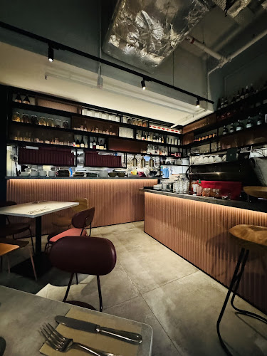 Paradise Pizza & Elixir Coffee and Wine - Holland - Singapore